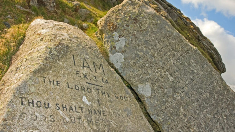 Inspirational stone with biblical verse engraved, promoting faith and strength for moms.